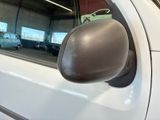 reflection of a car in the side mirror of a car in a garage