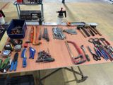 a table with many tools on it in a room