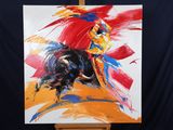 a painting of a bull on a easel with a black background