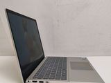 an open laptop computer sitting on top of a white table