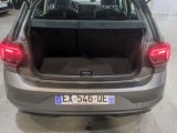 the back end of a car with its trunk open in a garage