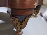 a wooden table with a clock on top of it