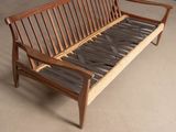 a wooden bench that is sitting in a room