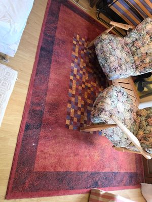 vue en plan d'un salon avec des fauteuils et un tapis