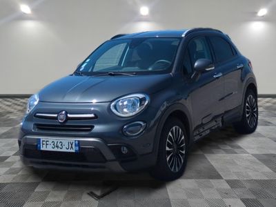 the grey fiat suv is parked in a garage with a checkered floor