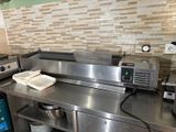 a large stainless steel counter in a commercial kitchen
