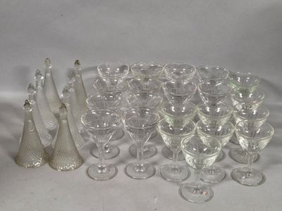 a lot of wine glasses that are sitting on a table