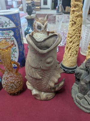 many different vases that are on a red table