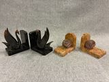 three wooden bookends sitting on top of a table next to each other