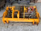 a yellow machine that is sitting on a pallet