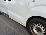 a white van that is parked on the side of the road