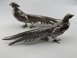 pair of silver plated pheasants on a white background