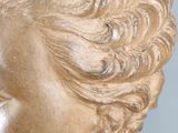a close up of a statue of a woman ' s head