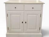 a close up of a white cabinet with two drawers and a sink
