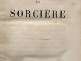 an old book with a black and white title on it