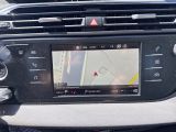 the dashboard of a car with a gps device on the dash
