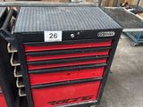 two red tool boxes sitting next to each other in a garage