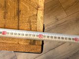 a ruler that is on top of a piece of wood