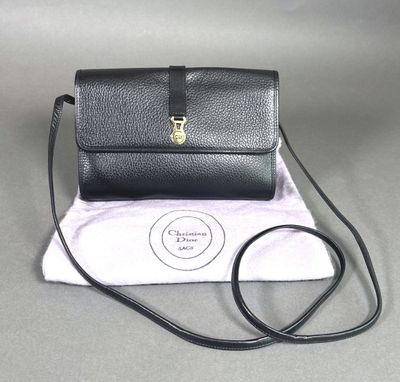 a small black purse with a gold clasp on it