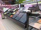 a produce section in a grocery store with fresh produce