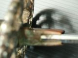 a close up of a metal object with a hole in it
