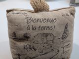 a small bag with a rope on it sitting on a table