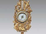 une image représentant une horloge dorée sur fond blanc, avec un fond gris