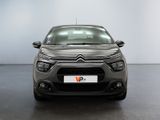 the front of a grey citrole parked in a room