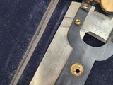 a very old type of caliper that is in a case