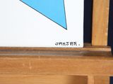 a picture of a picture of a blue triangle on a easel