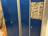 two blue lockers that are next to each other in a room