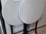 two tables that are sitting next to each other on the floor