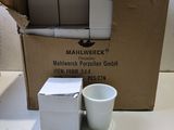 a box of mailwracks and a cup sitting on a table
