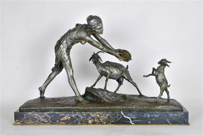 bronze statue of a woman and two dogs on a marble base