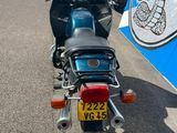 a motorcycle that is parked on the side of the road