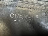 a close up of a black chanel bag with the name chanel on it