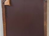 a chalk board with a piece of wood on top of it