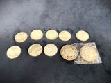 a bunch of gold coins sitting on top of a table