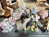 a lot of stuffed animals that are sitting on a table