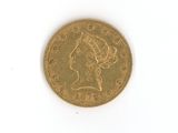 une pièce d'or avec l'image d'une femme dessus