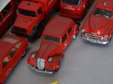 a lot of toy cars that are sitting on a table