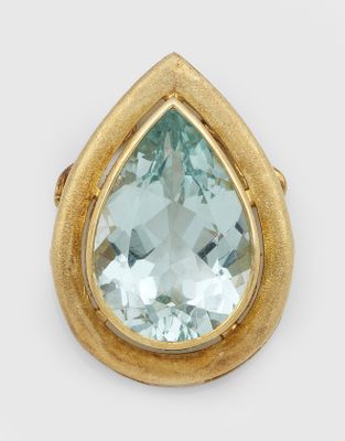 an image of a gold and aquamarinee tear shaped ring