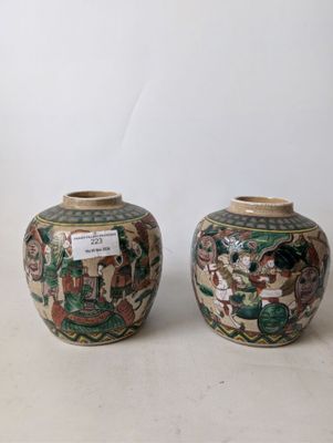 two vases that are sitting on a table