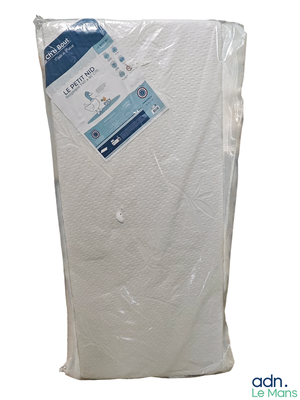 a mattress that is wrapped in plastic on a white background