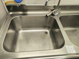 a sink with a faucet and a faucet attached to it