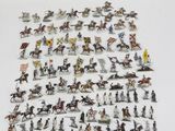 many figurines of different types and sizes on the table