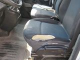 an image of a van with dirty seats in the back