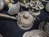 many different types of antique lamps on the table