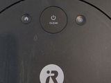 a close up of a remote control on a black surface