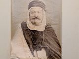 a picture of a man with a beard and a turban on the wall